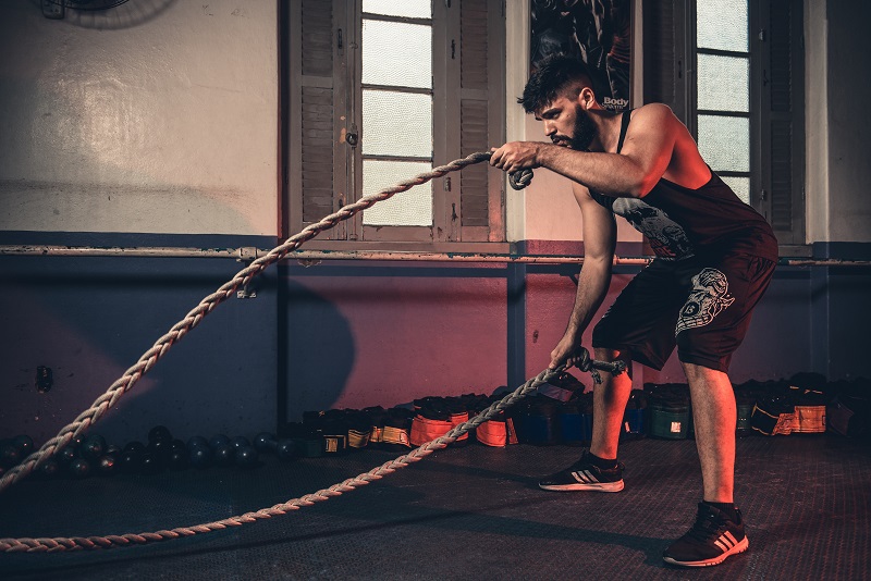 Man gyming with ropes - Dope Uncle