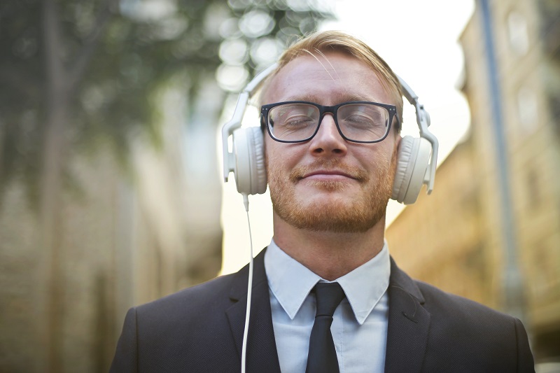 Smiling man with headphone on - Dope Uncle