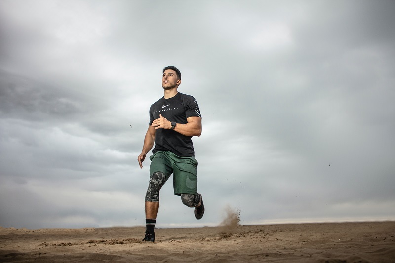 Man running on sand