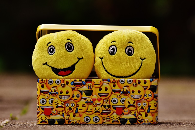 Smiling emojis in a chest